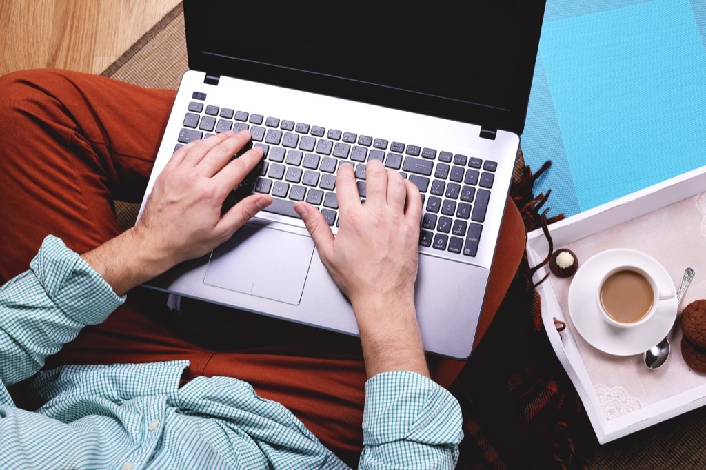 man on laptop, things you shouldn't store in your basement