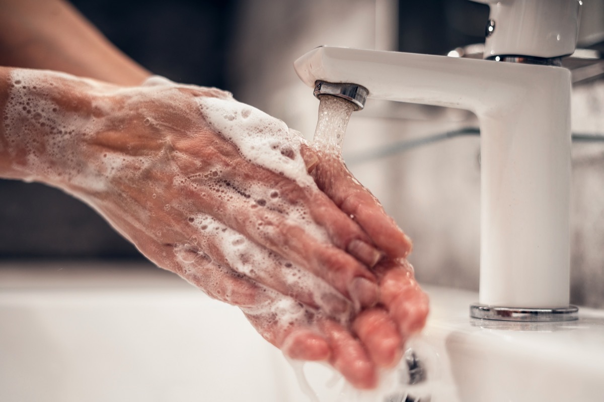 washing hands in sink