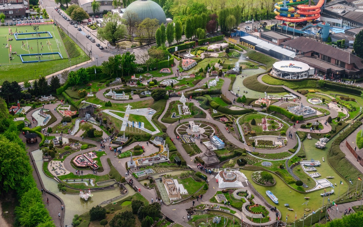 Panoramic view from the observation deck on the top level of the Atomium - the green trees, modern and historic buildings, and miniature Park