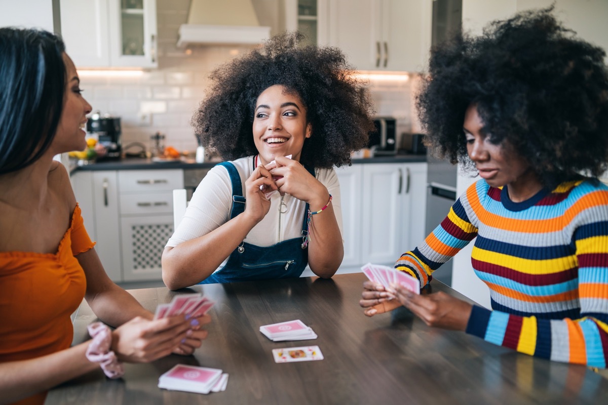 three girls playing cards