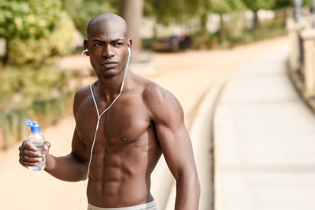 man with strong muscles resting after a workout