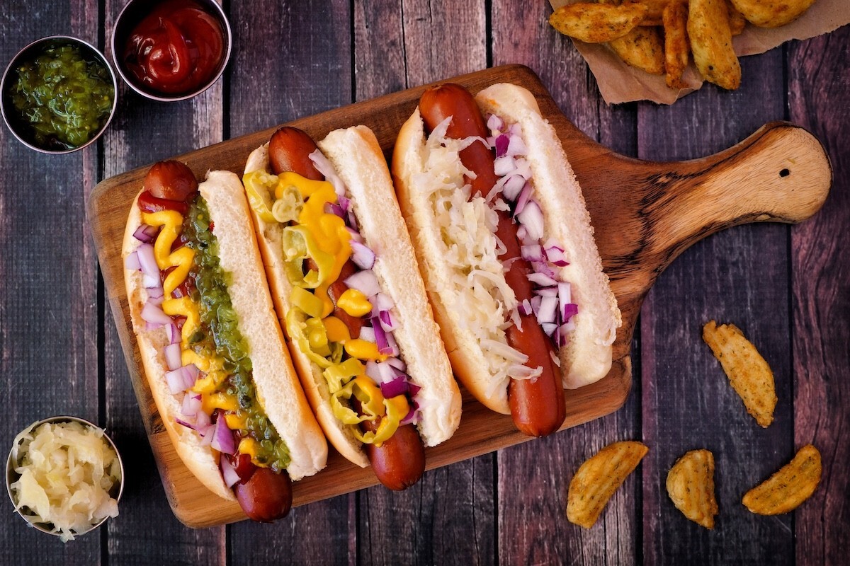 three hot dogs with different toppings