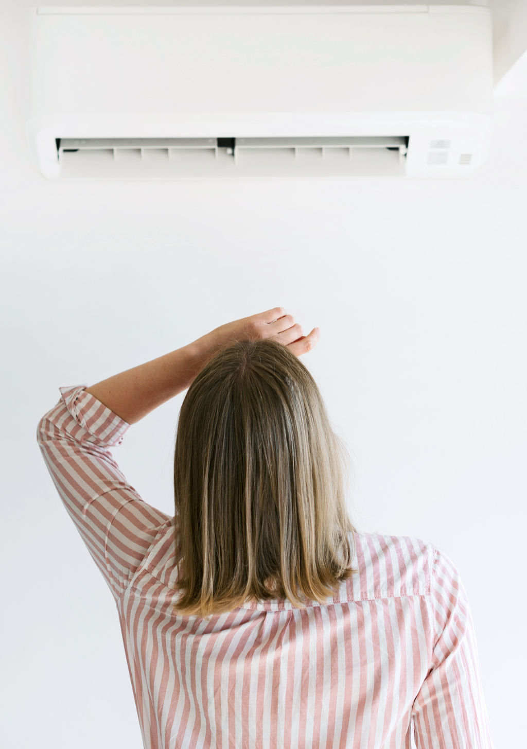 Woman with Air Conditioner home problems