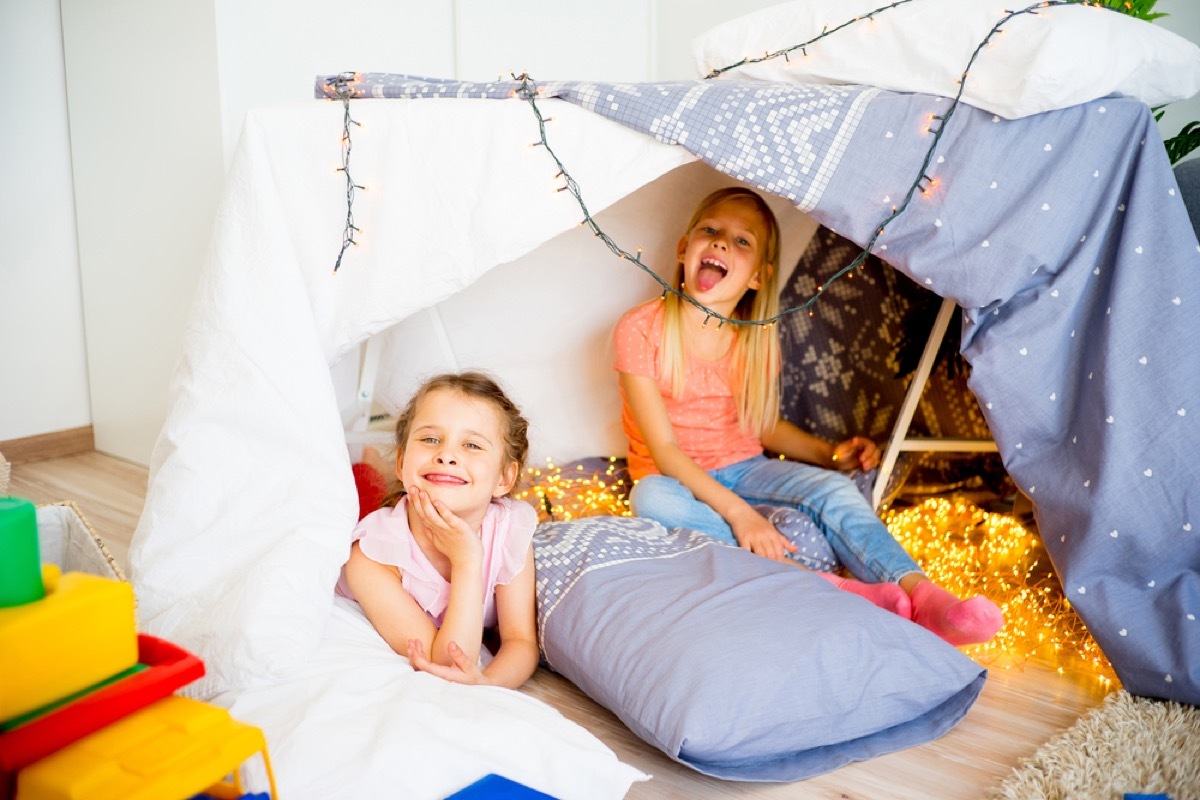 two young girls having slumber party in tent, bad parenting advice