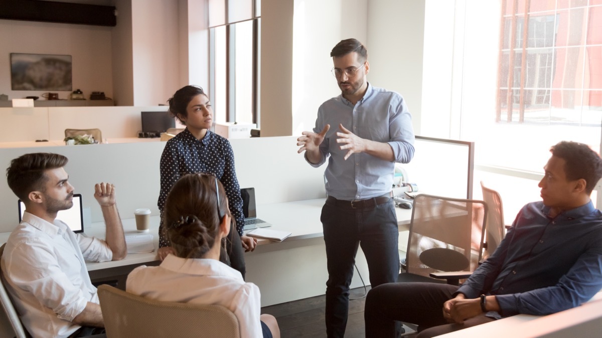 team leader speaking to group at work