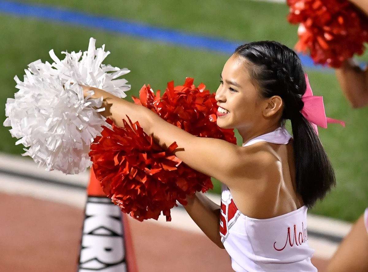 cheerleader on football field,