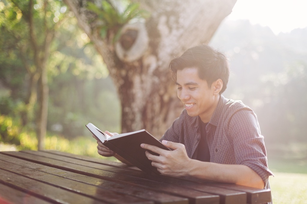 Man Smiling and Reading Poems self-care tips