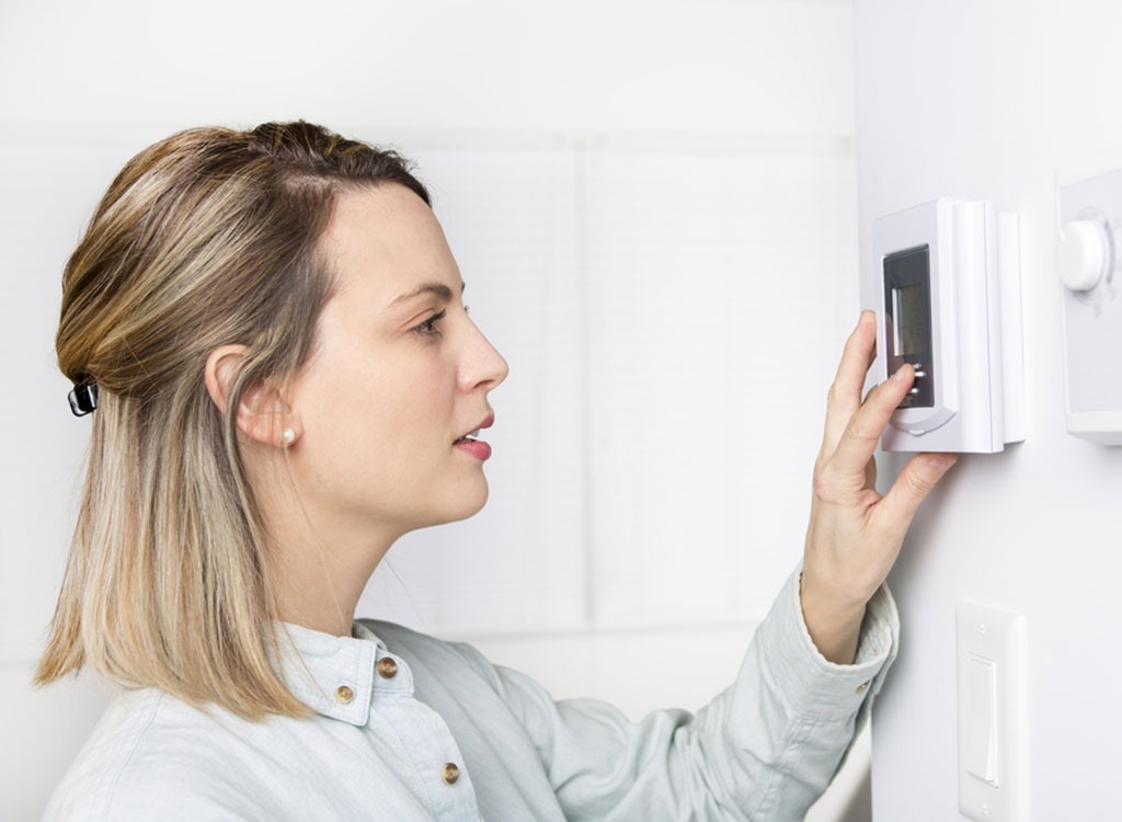woman and thermostat