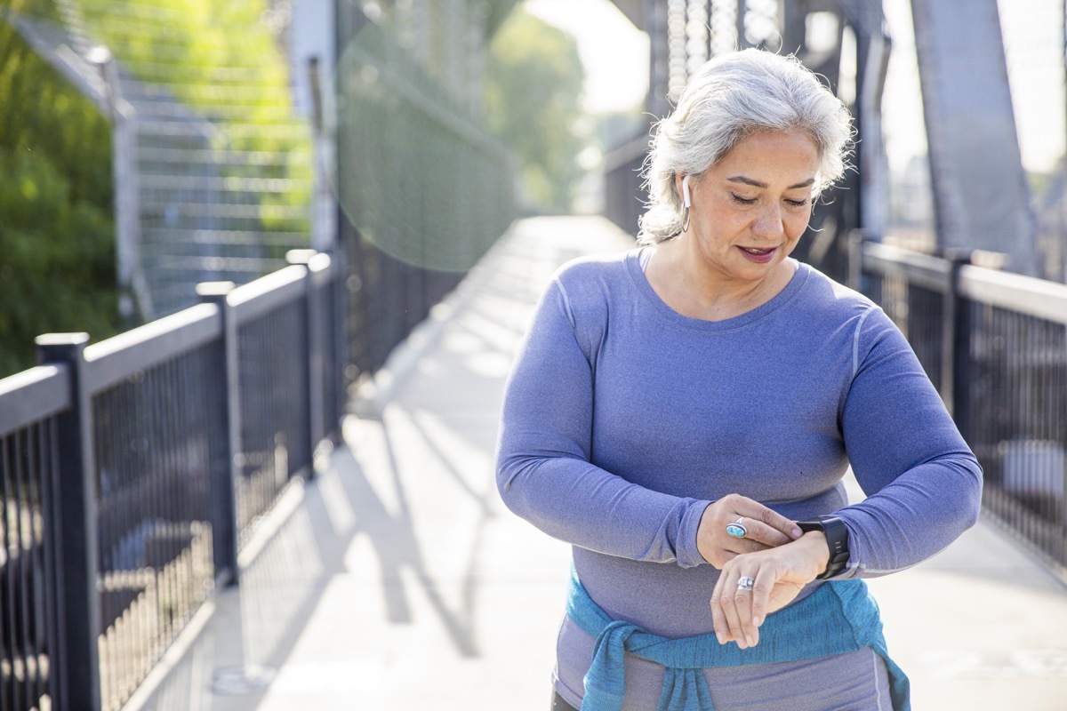 woman checking her fitness tracker
