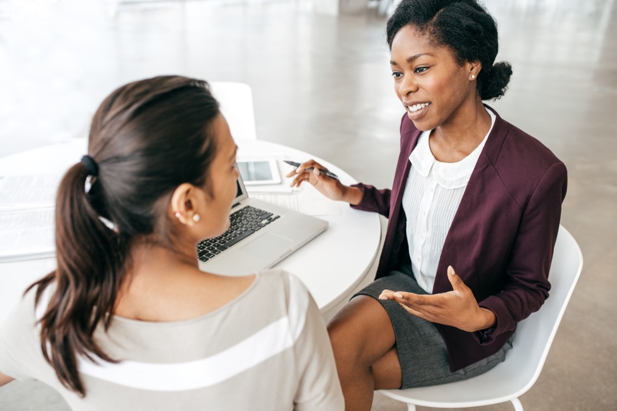 Two women having a conversation at work how to have a conversation