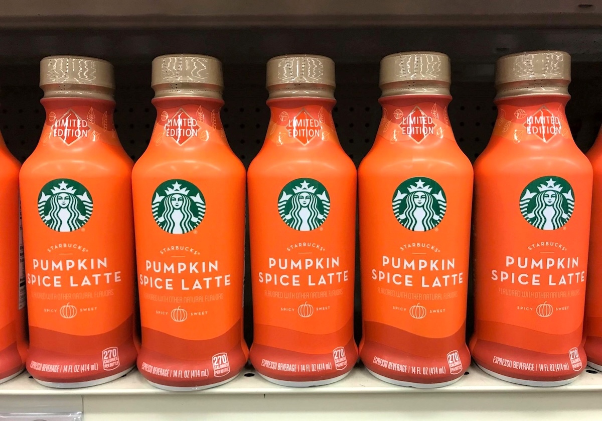 Starbucks' pumpkin spice latte drinks on a shelf in the grocery store