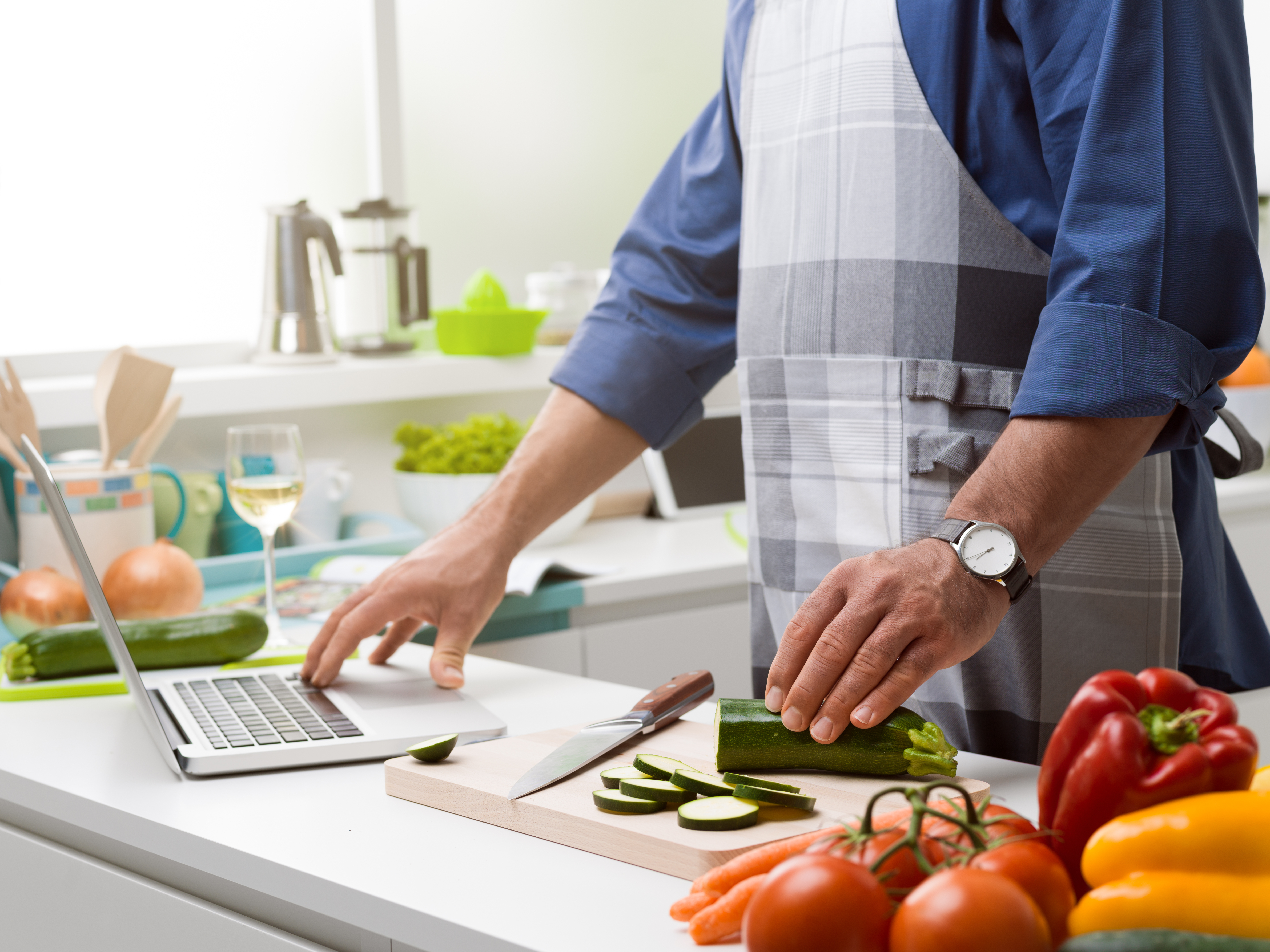 man learning to cook online when bored