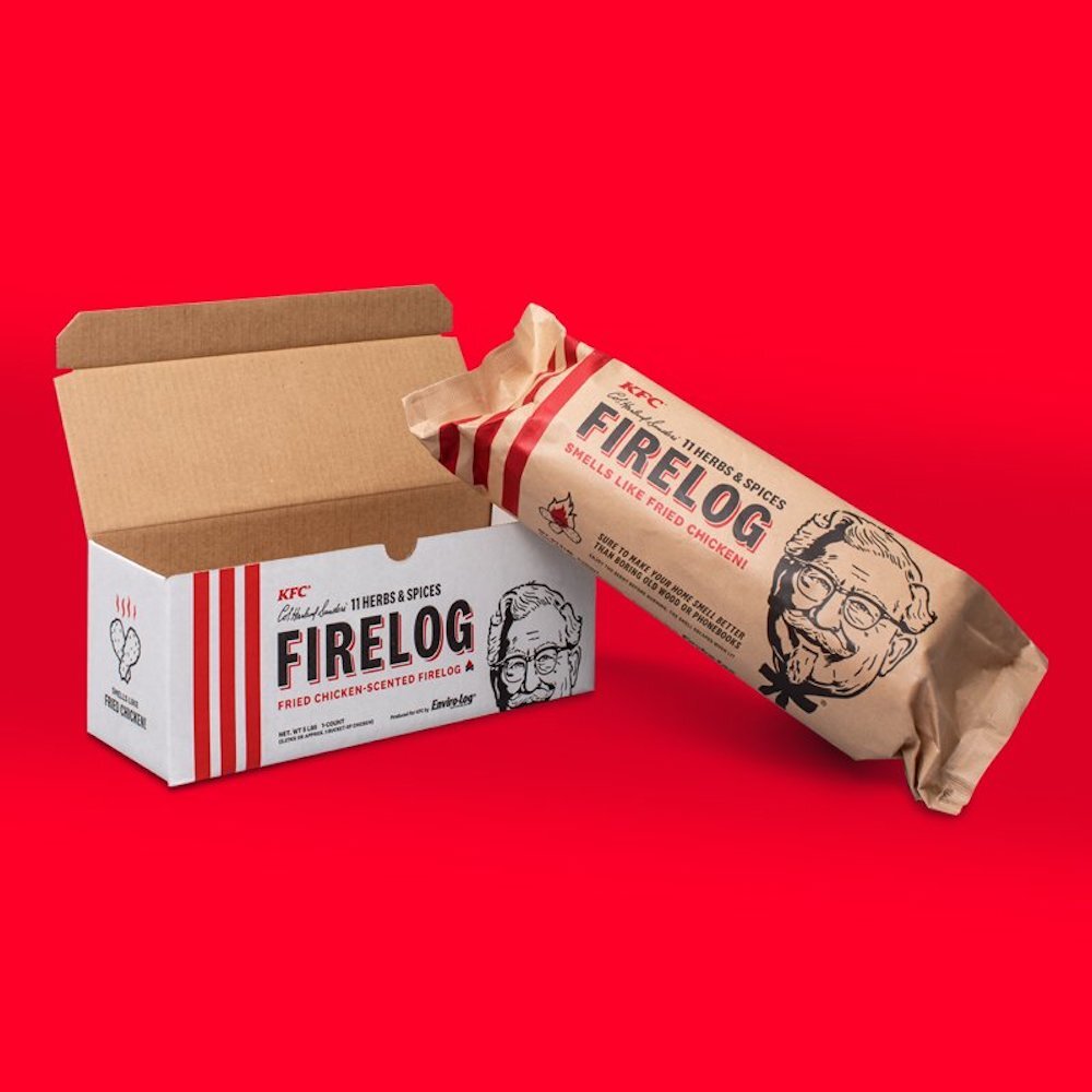 KFC firelog resting on box with colonel sanders face, advertising it