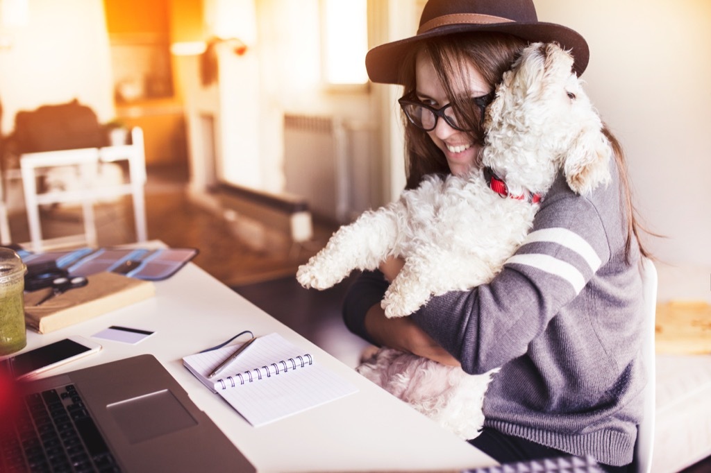 Woman holding pet dog