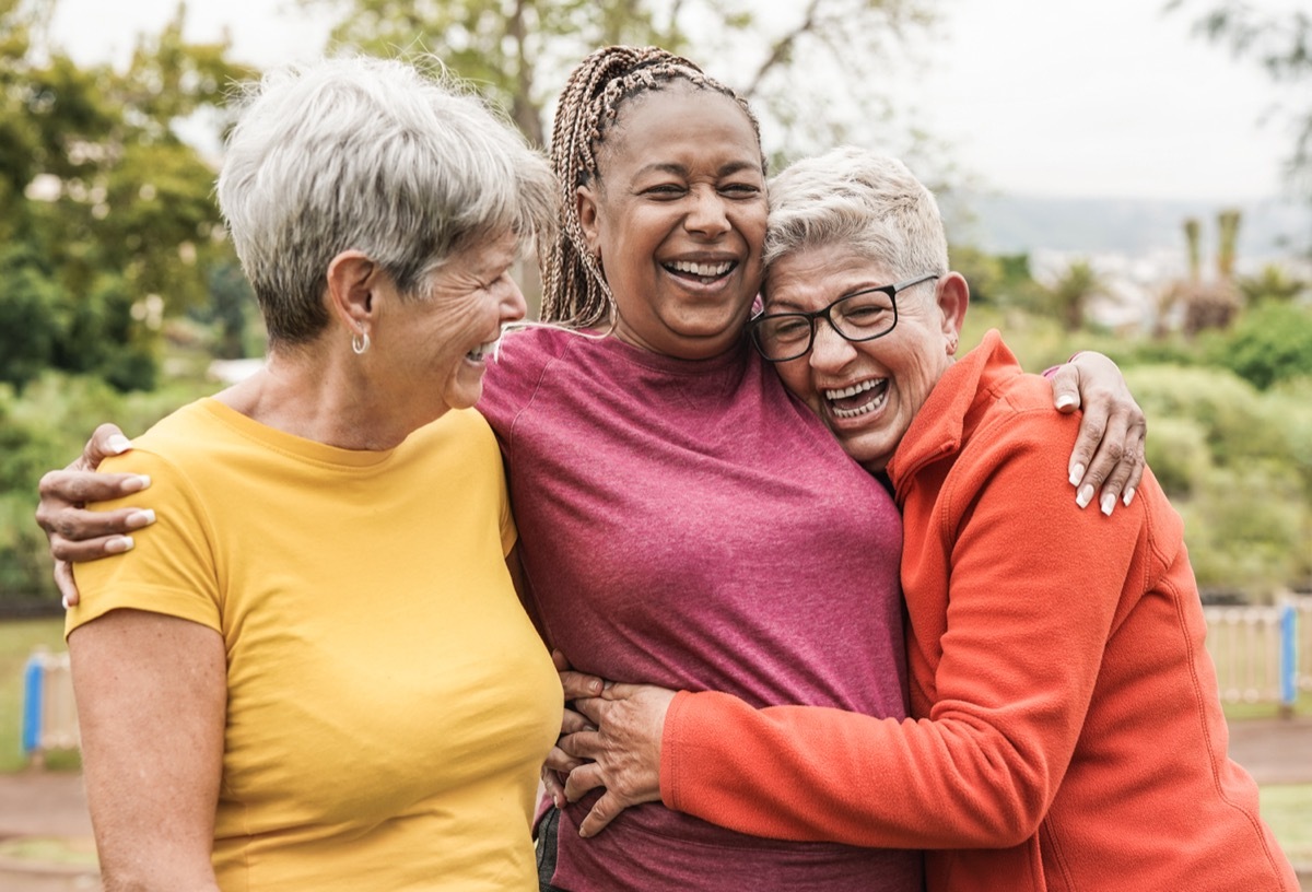 group of girl best friends embracing