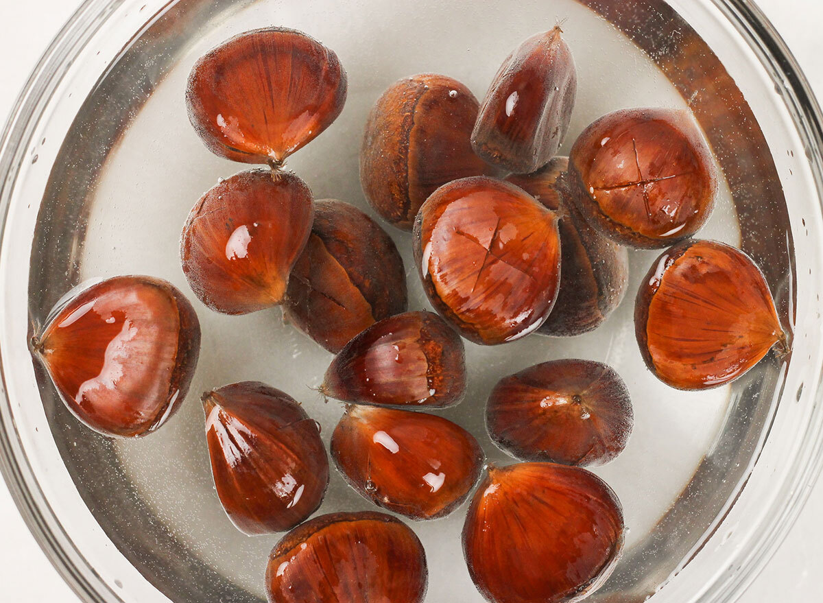 soaking chestnuts in a bowl with hot water