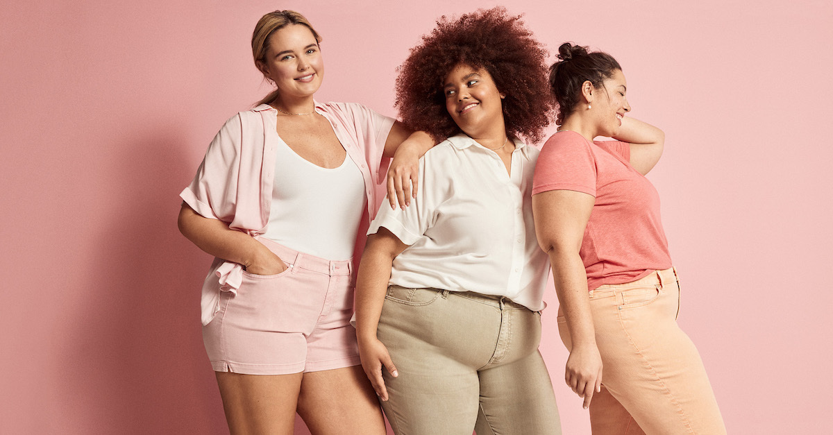 Three models wearing Lane Bryant clothing in pink and neutral hues