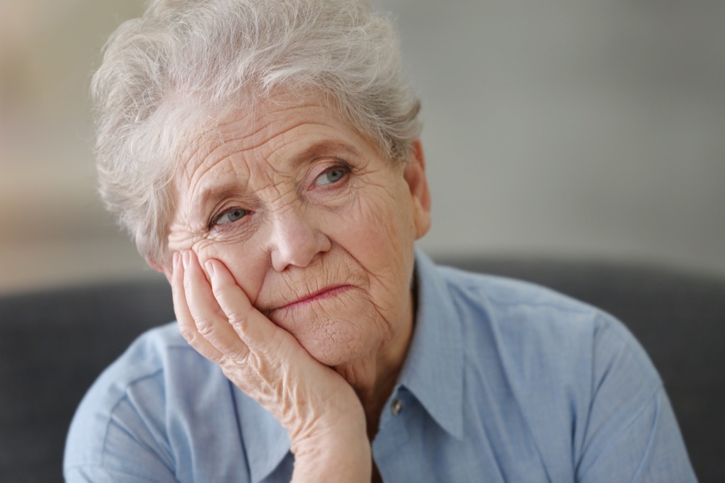 bored elderly woman earliest signs of alzheimer's