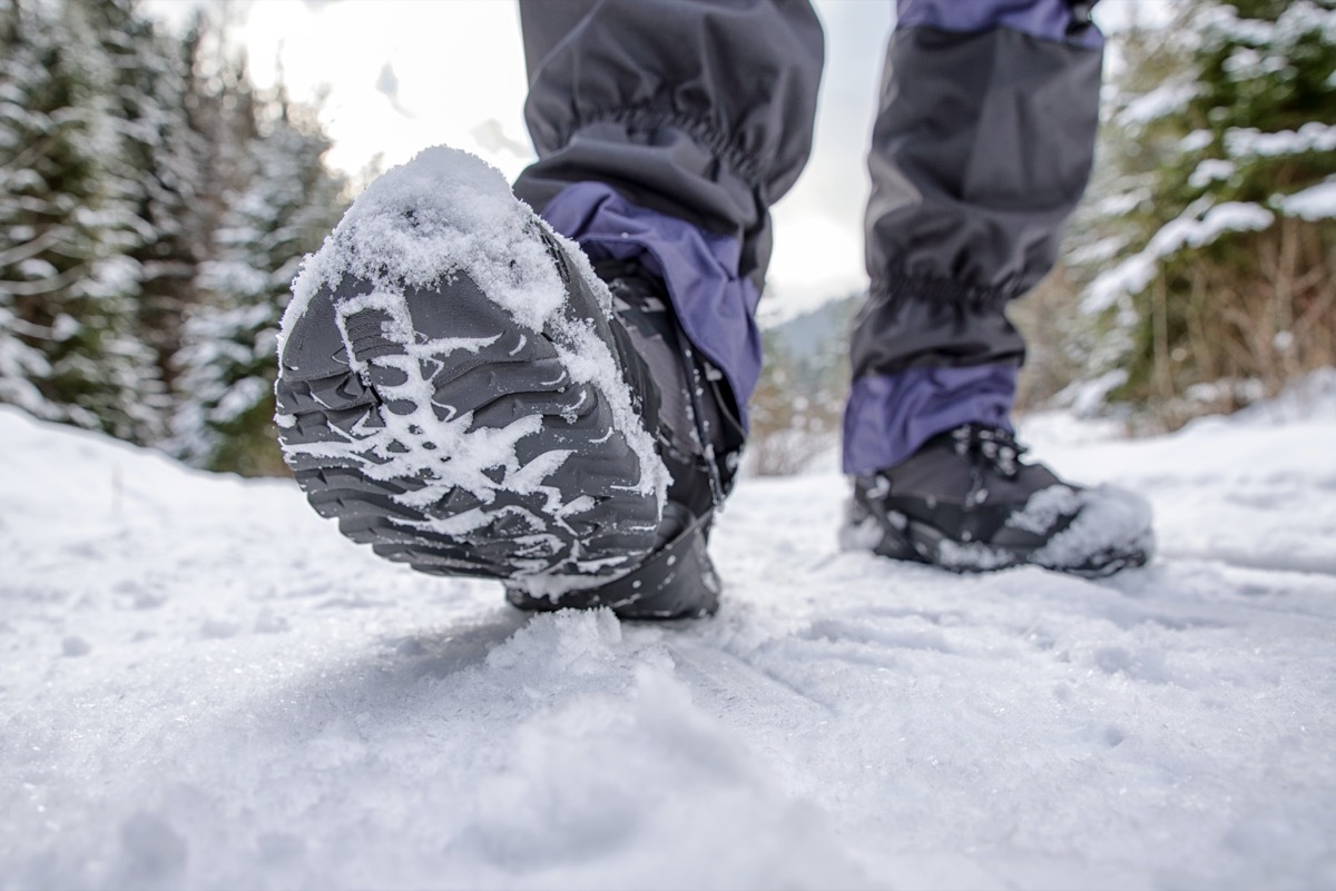 black hiking boots walking outside in the snow
