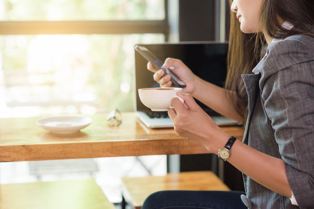 woman on phone at computer