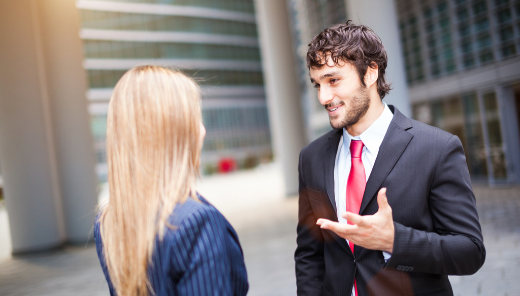 Businessman and businesswoman talking