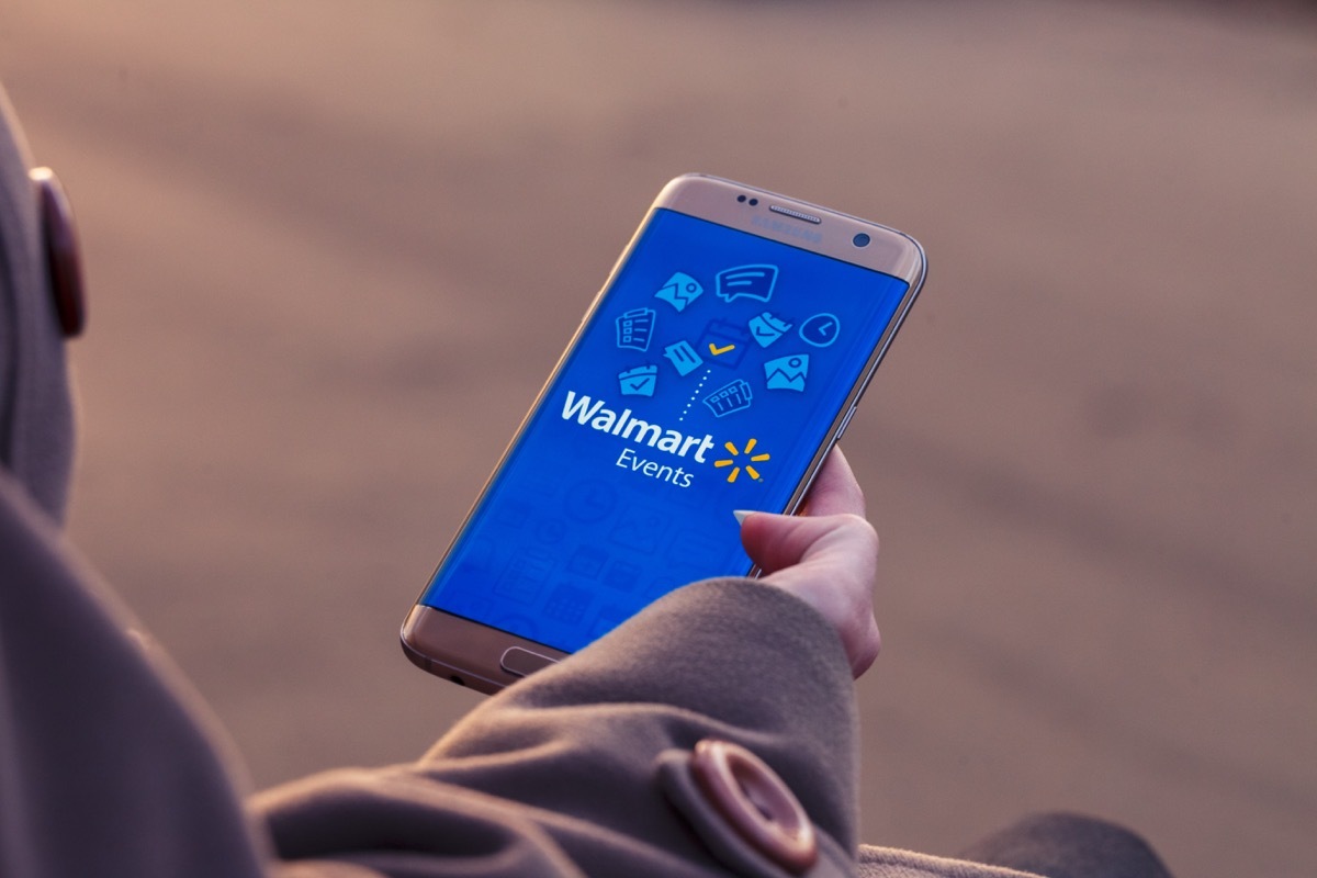 Woman looking at Walmart site on phone