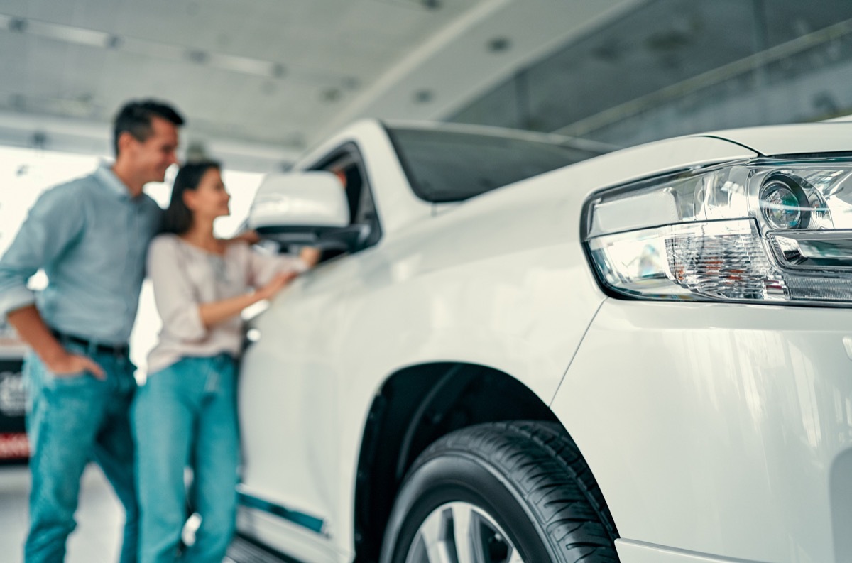 couple searching for a car at dealership