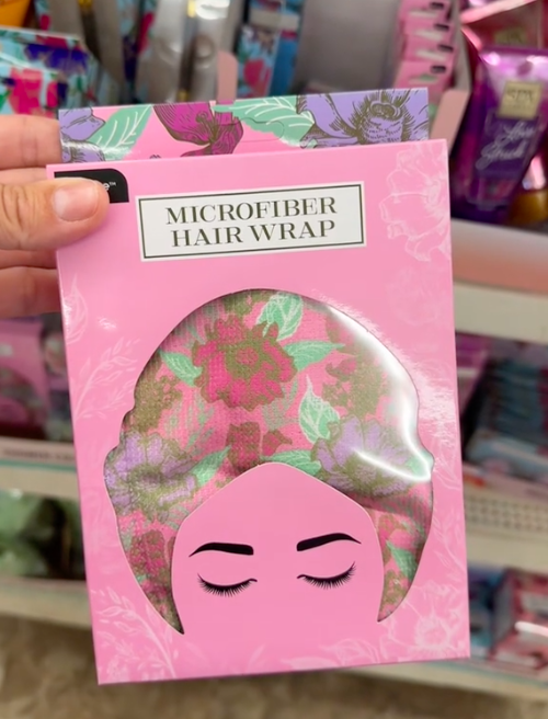 A shopper holds microfiber hair wraps while shopping for the best Mother's Day gifts at Dollar Tree.