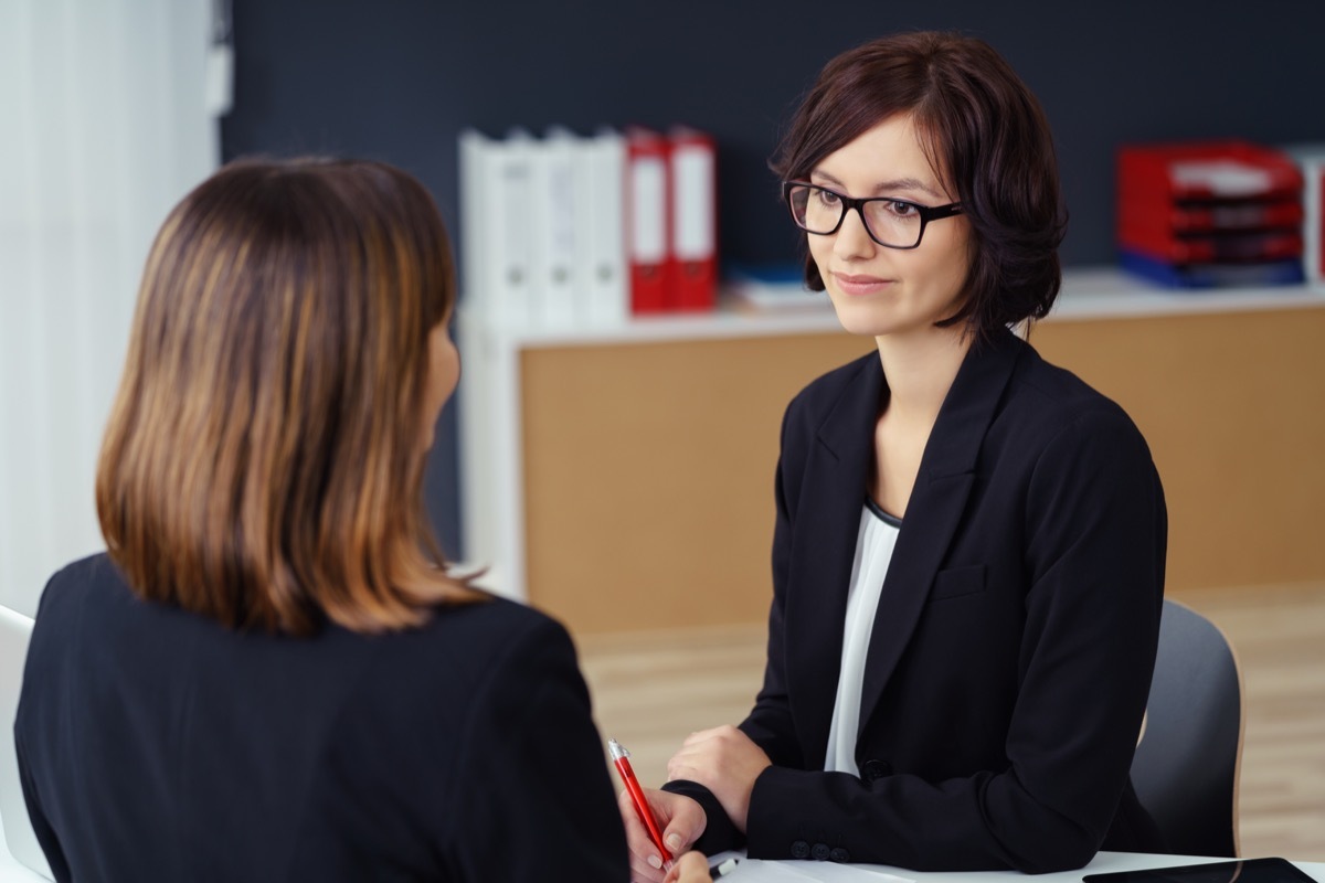 unhappy woman talking to receptionist