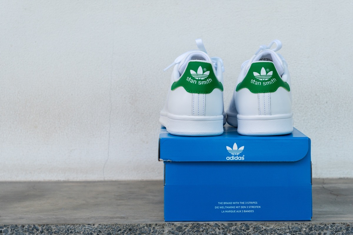 classic pair of adidas shoes on top of adidas box