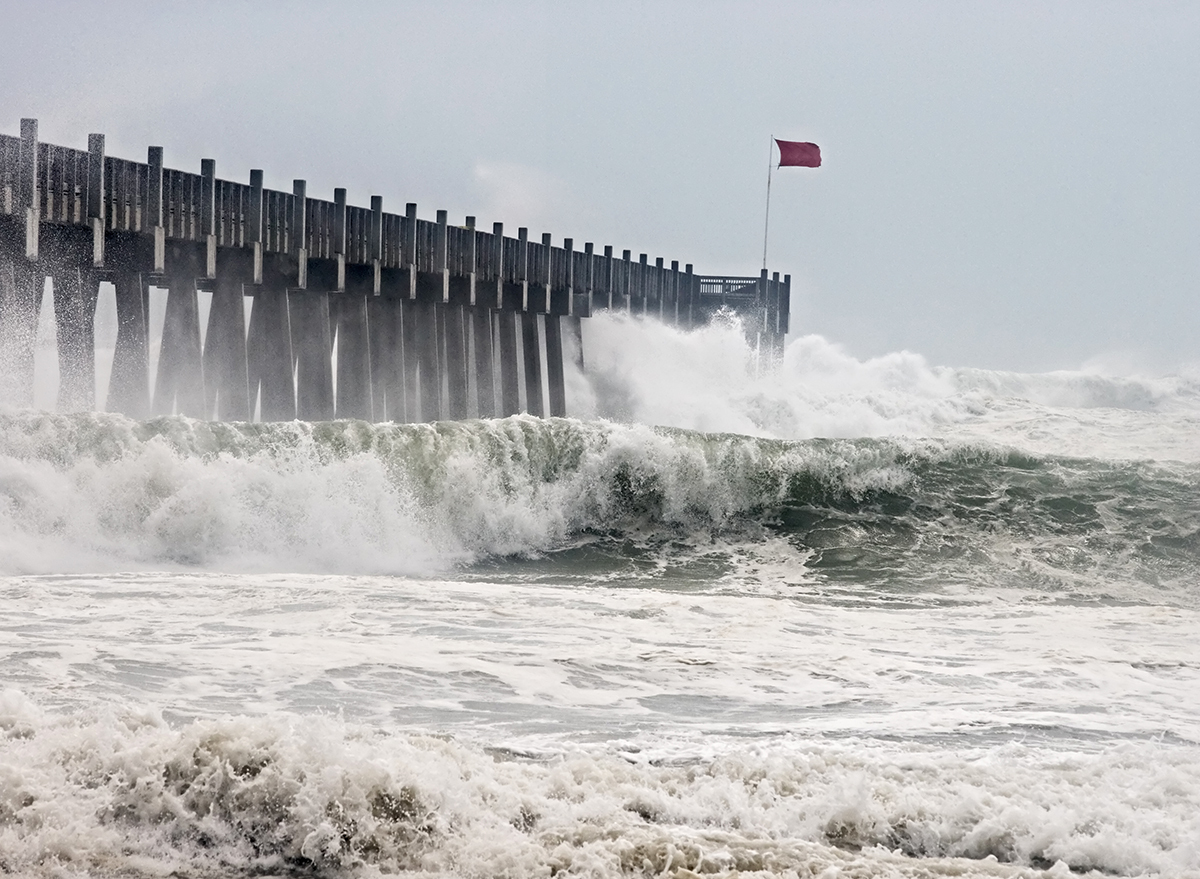 Waves crashing into pier during storm