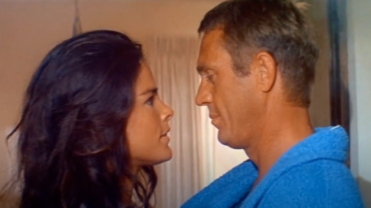 ali macgraw and steve mcqueen about to kiss in