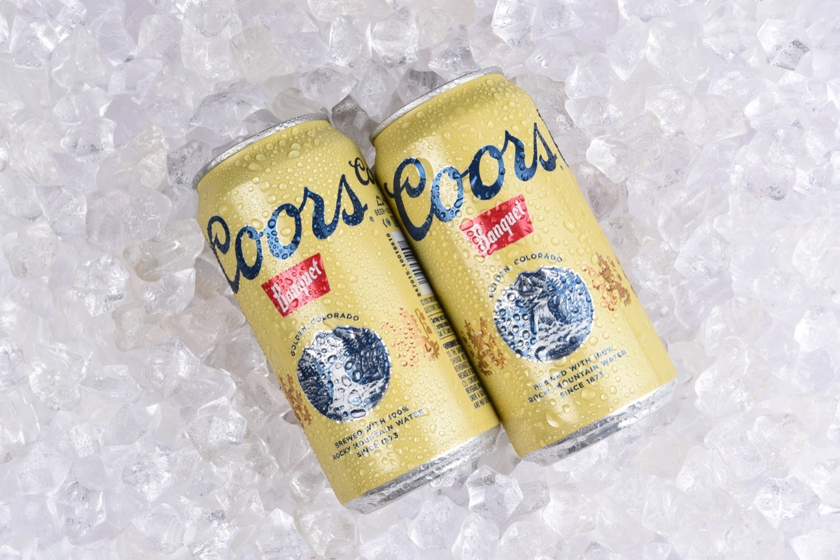 Two cans of coors banquet on ice