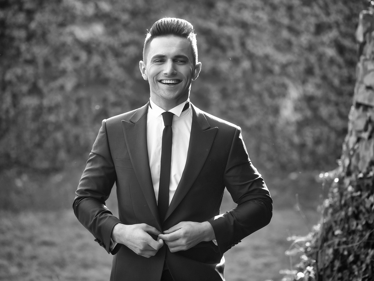 guy wearing a skinny tie and a peak lapel jacket