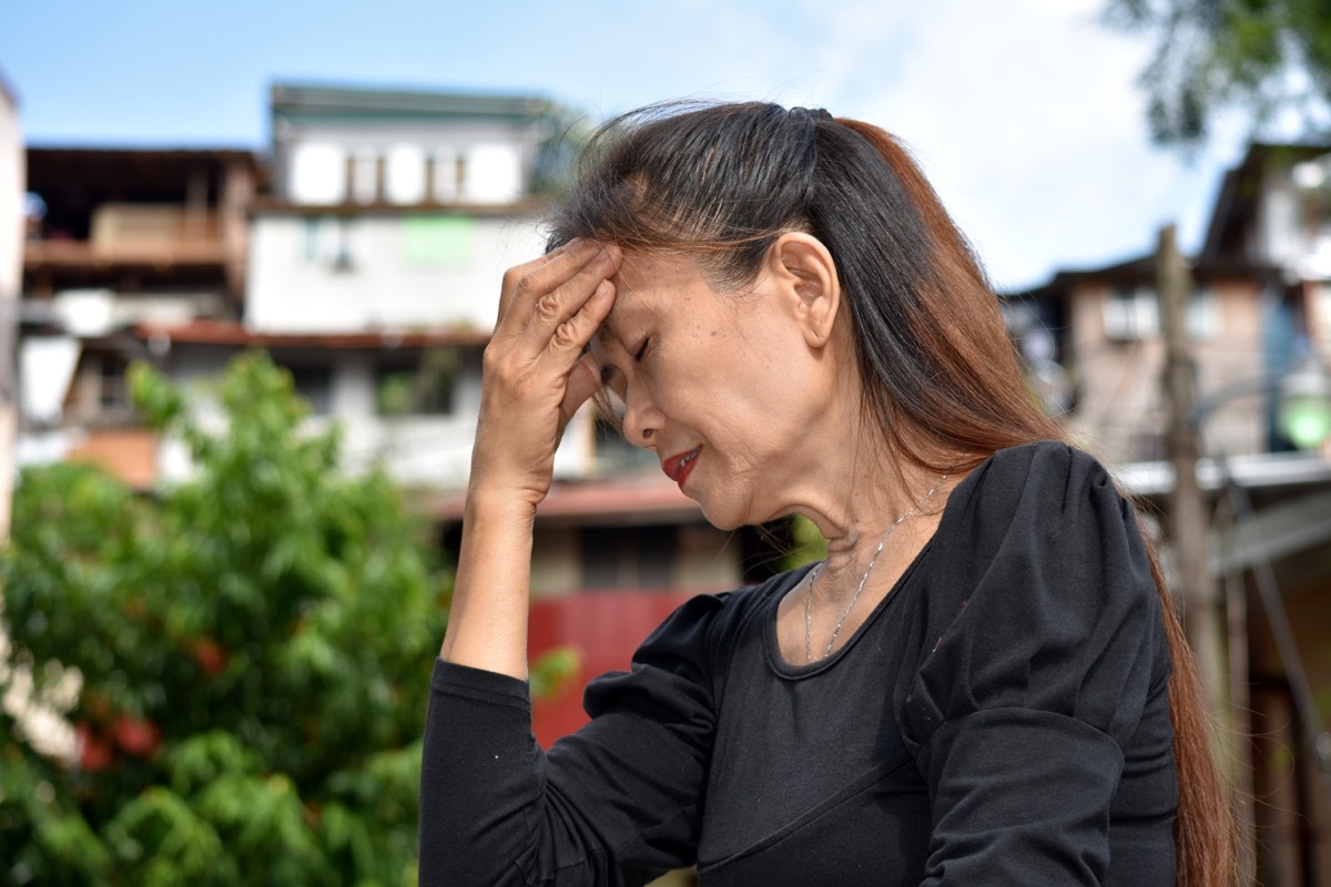 confused older woman outside health problems from lack of sleep