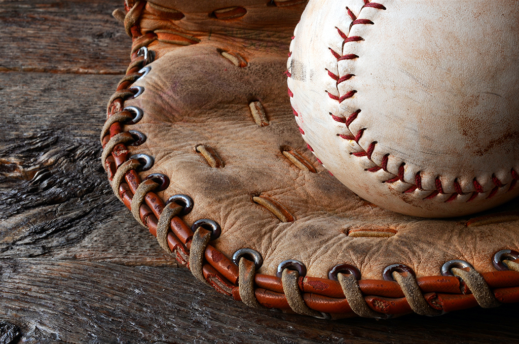 Weathered baseball glove and ball
