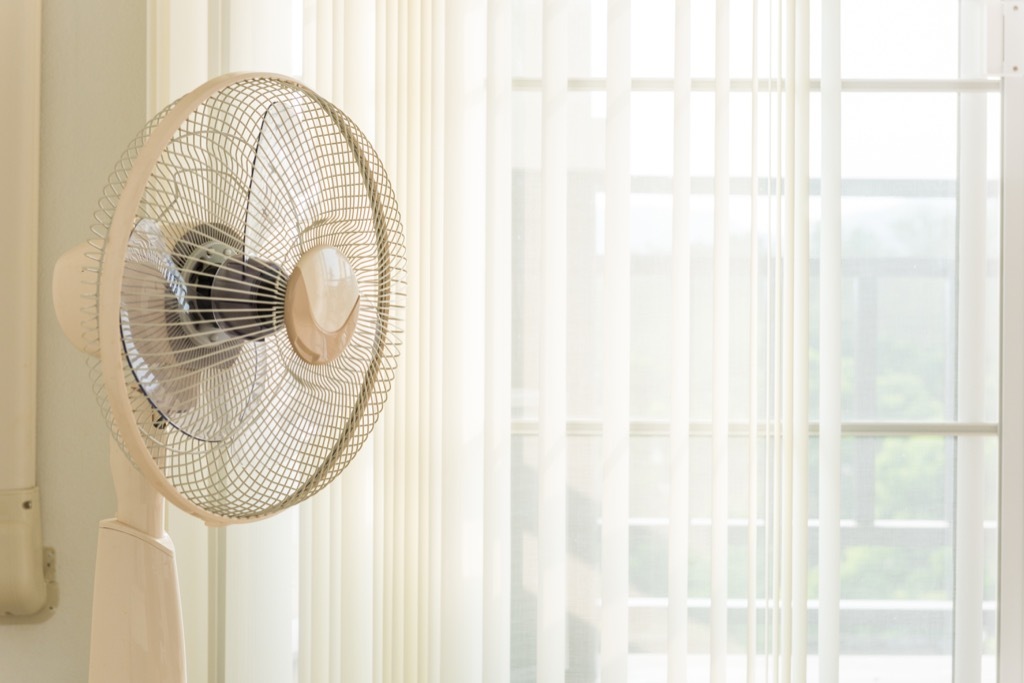 Fan blowing near window
