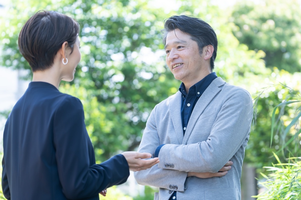 man and woman having conversation