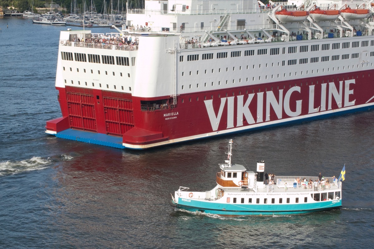 Shutterstock Cruise ship with smaller ship cruise ship facts