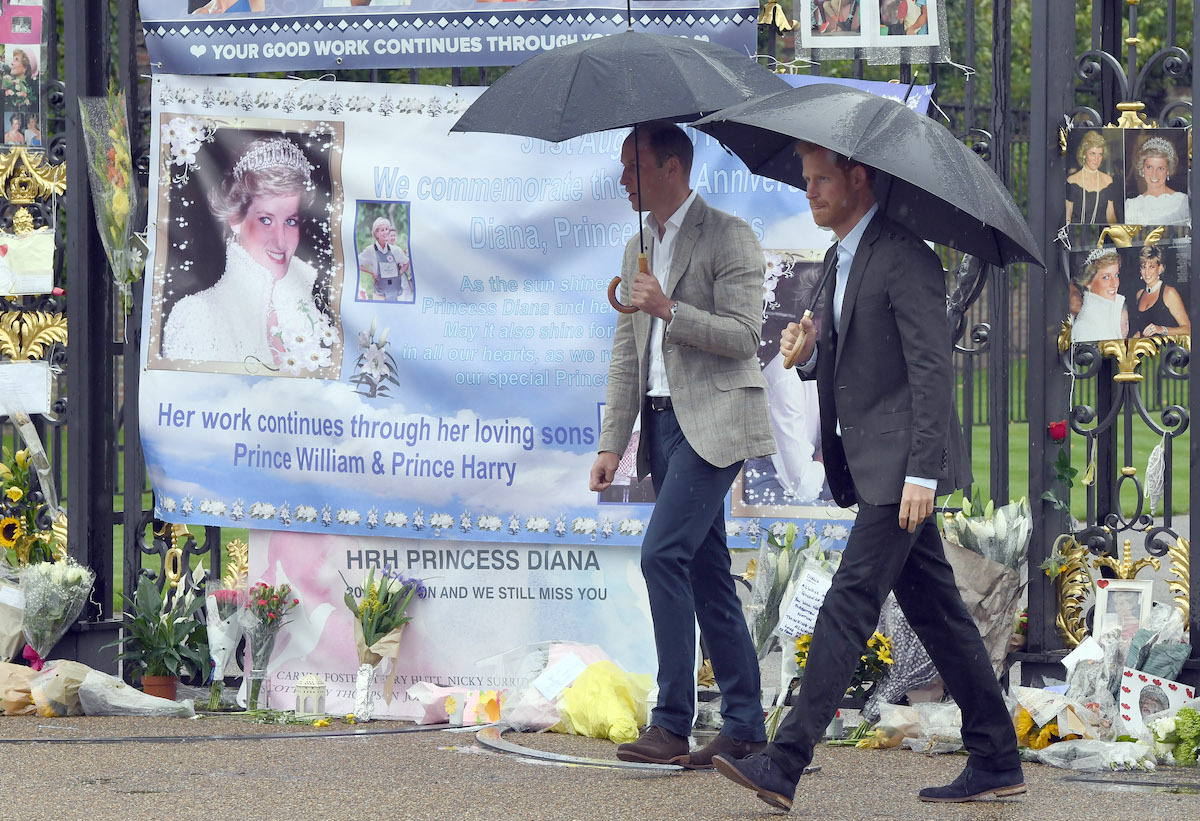 Prince William, Duke of Cambridge and Prince Harry view tributes to their mother Princess Diana following a visit to The White Garden in Kensington Palace dedicated in the memory of Princess Diana on August 30, 2017 in London, England.