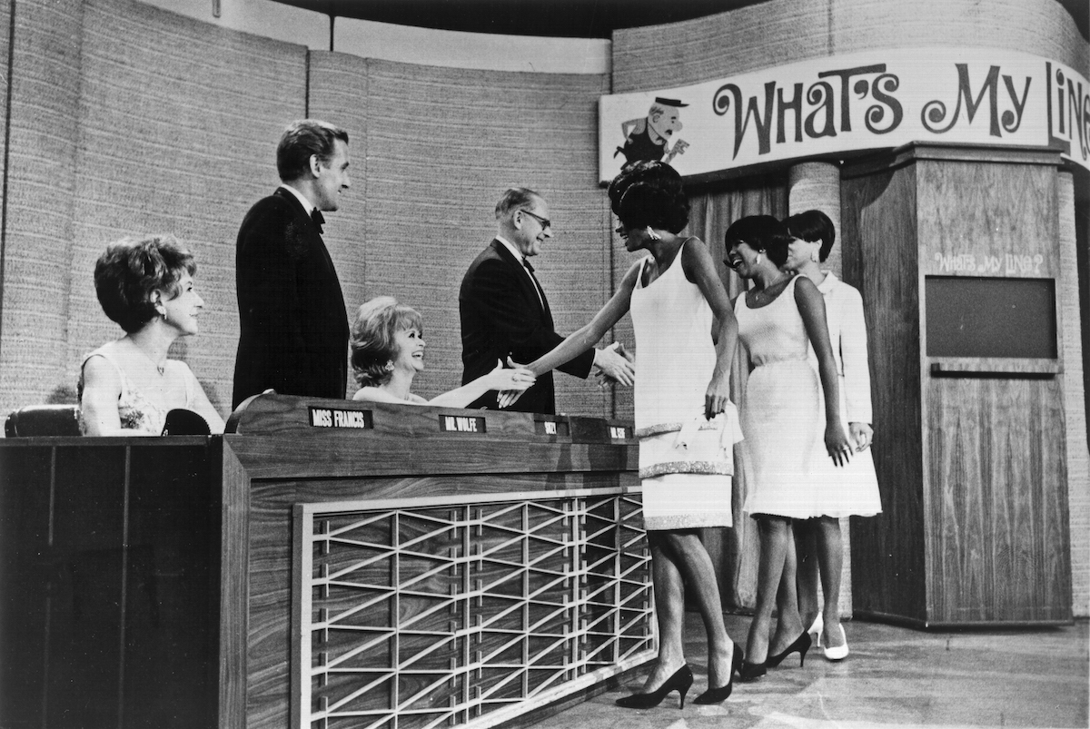 The Supremes shaking the hands on the panelists on