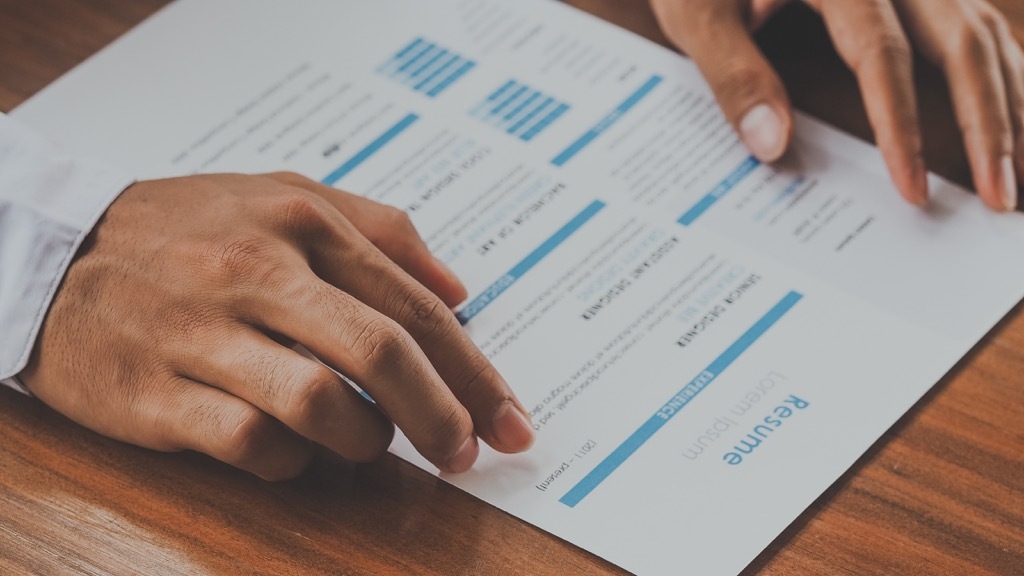 Looking at resume, female friend