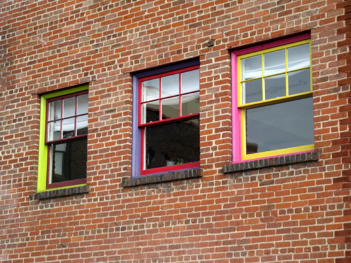 Colorful gridded windows on brick building