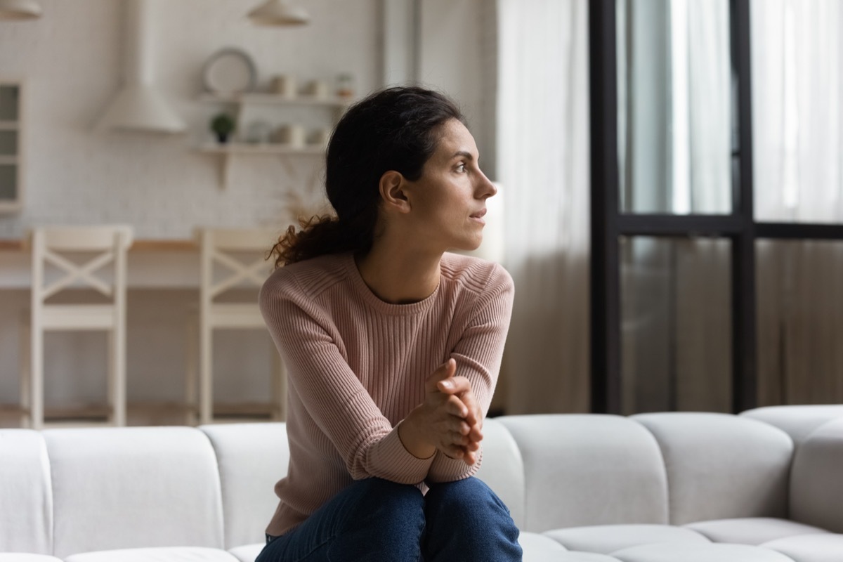A woman outside of her window.