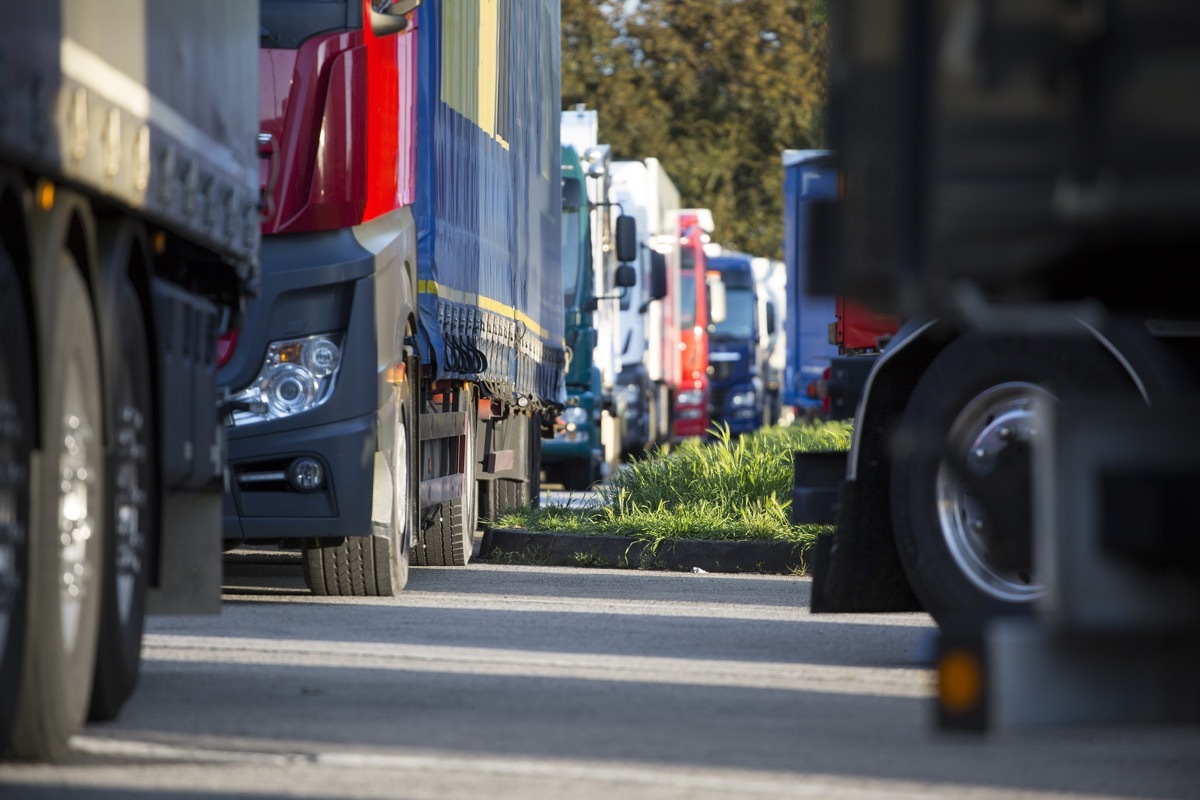 trucks stopped at a crowded rest area