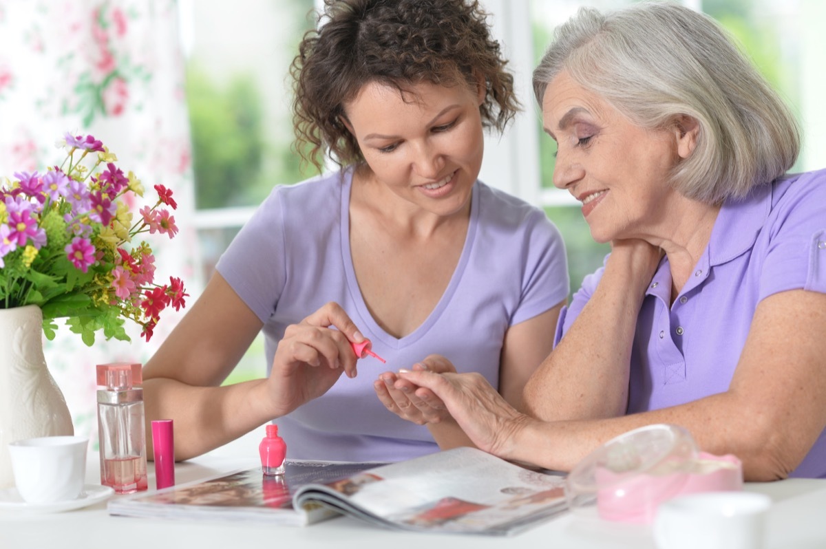 older woman trying out nail polish