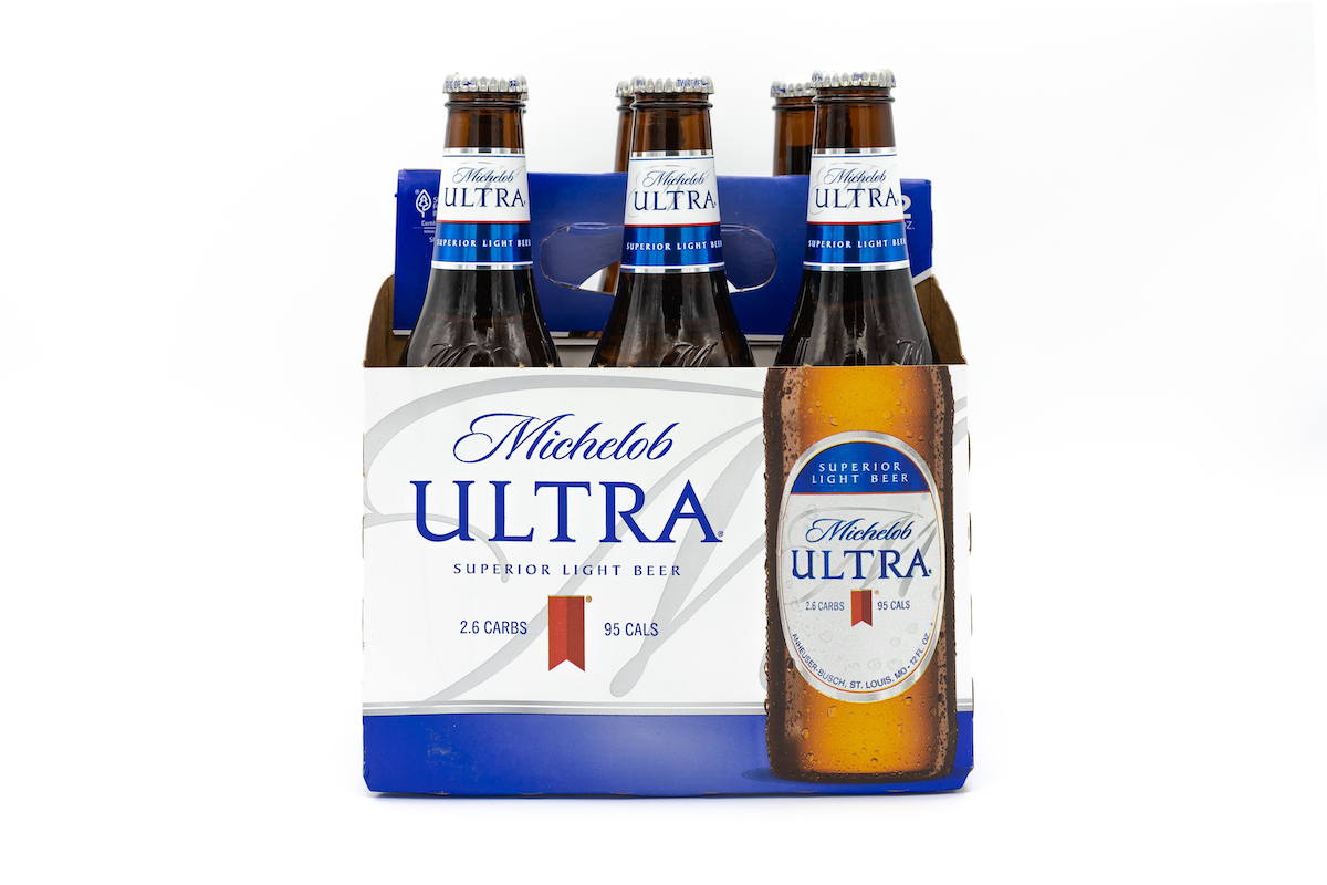 Pack of Michelob ULTRA Superior Light Beer on white background.