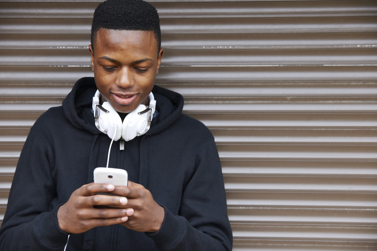 teenager on smartphone differences between millennials and generation z