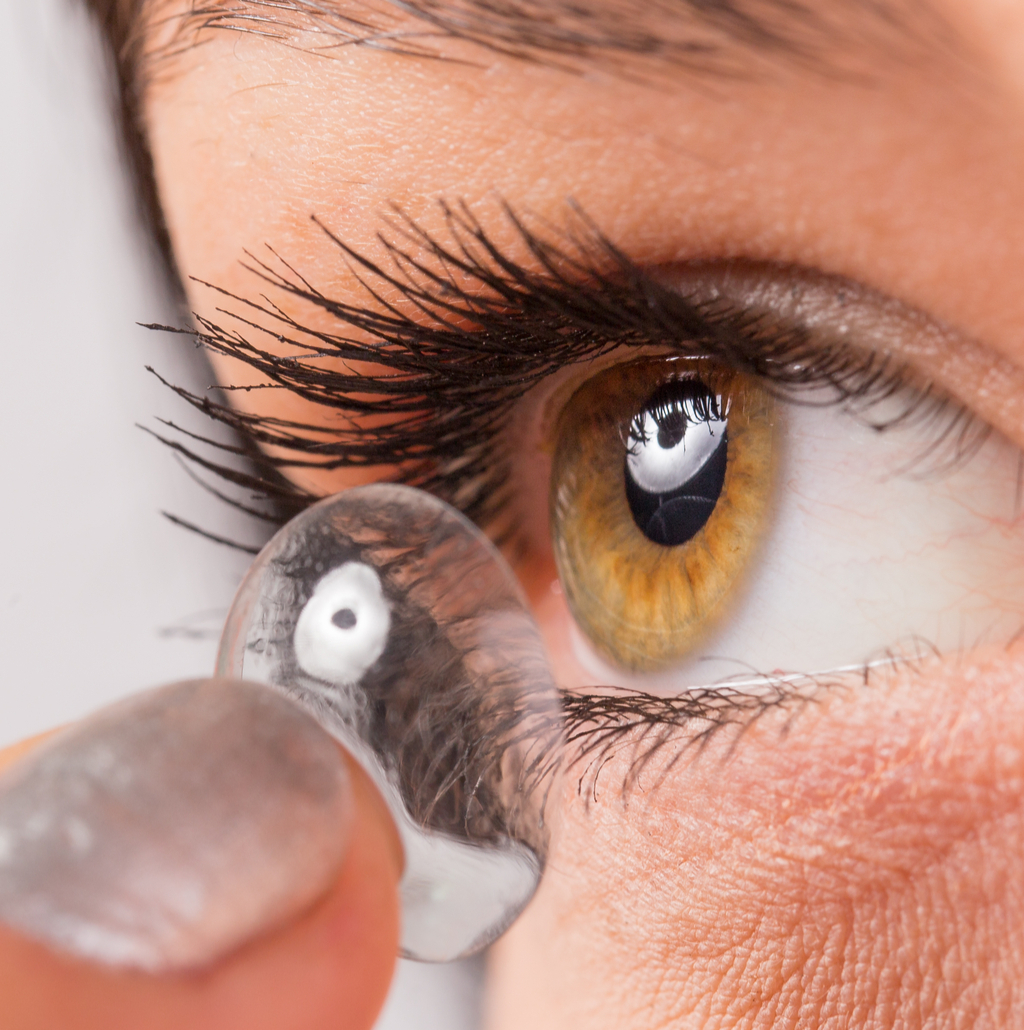 woman putting in contacts gross everyday habits