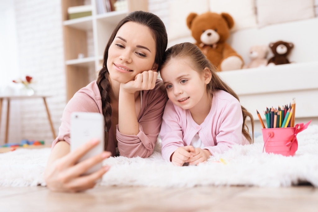 Mother and daughter on Smartphone